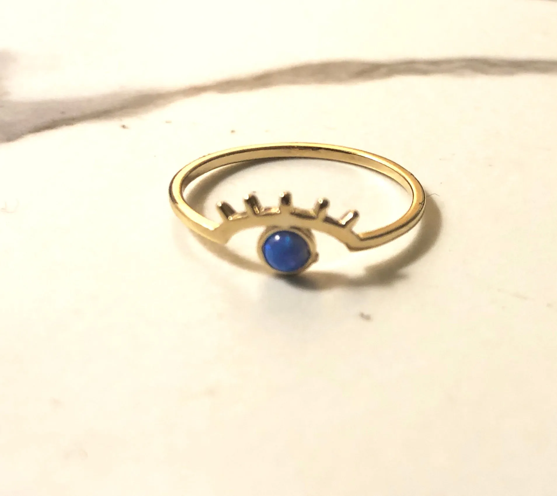cosmic blue eyed wink ring