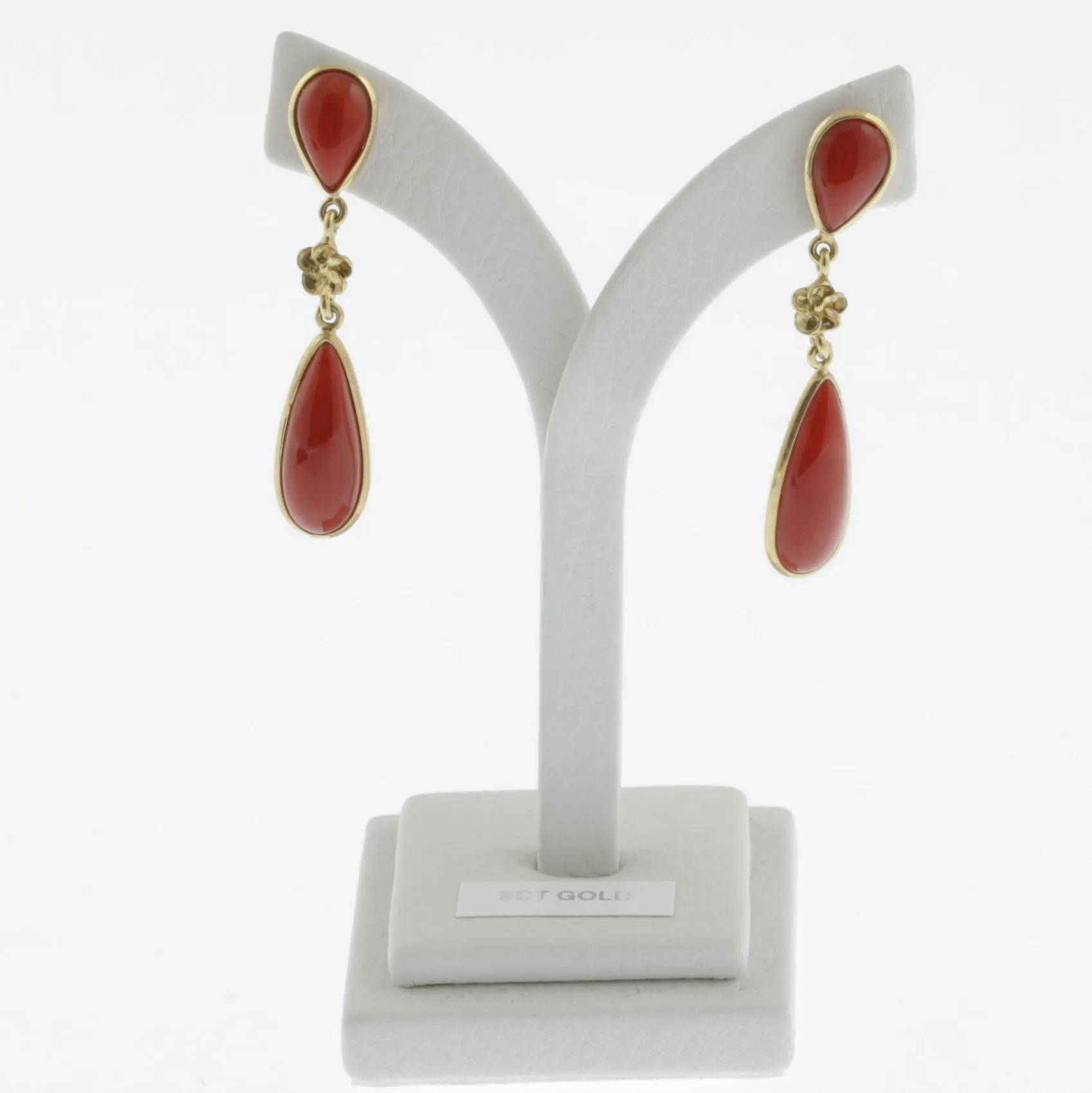Meditteranean coral cabachon dual tear drop earrings with flower detail in yellow gold